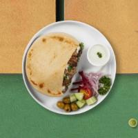 Go Go Gyro Sandwich · Chicken or lamb meat roasted and sliced into a pita bread with lettuce, tomato and tradition...