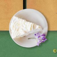 Cuckoo For Coconut Cake · Frosted cake with a white frosting and covered in coconut flakes