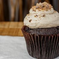 Peanut Butter Cup · Chocolate with peanut butter frosting topped with crumbled peanut butter cups.