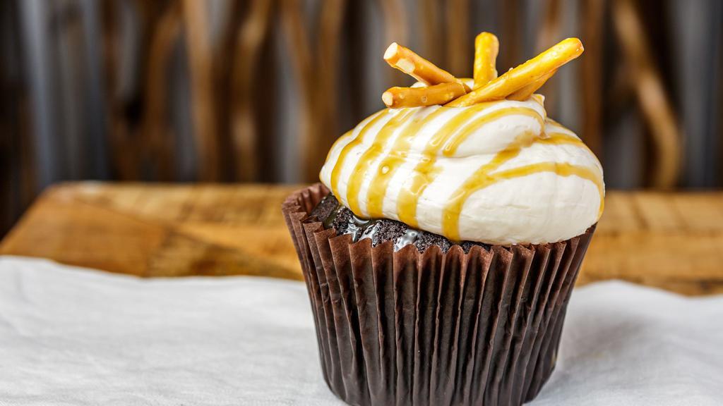 Caramel Crunch · Chocolate or vanilla cake with caramel frosting topped with sea salt and pretzels.