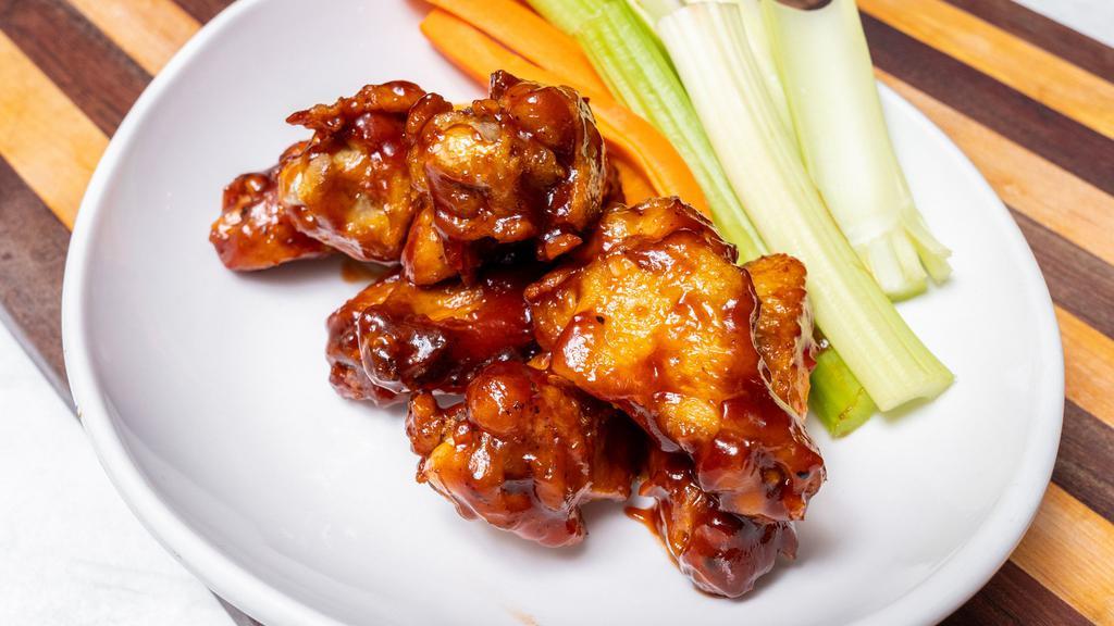 Chicken Wings (8) · Marinated & Roasted, Signature Buffalo or Kansas City
Style BBQ Sauce, Carrots, Celery, Blue Cheese