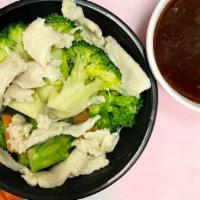 Steamed Chicken With Broccoli · Served with white rice and a choice of sauce on the side.