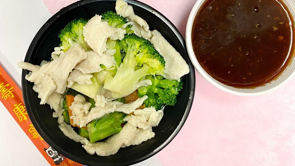 Steamed Chicken With Broccoli · Served with white rice and a choice of sauce on the side.
