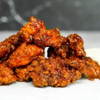 6 Crispy Boneless Wings · 6 crispy, boneless chicken wings fried to perfection. Served with celery and carrots sticks ...