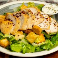 The Roast · Out brick oven-roasted chicken breast, sliced and served hot on top of a classic caesar sala...