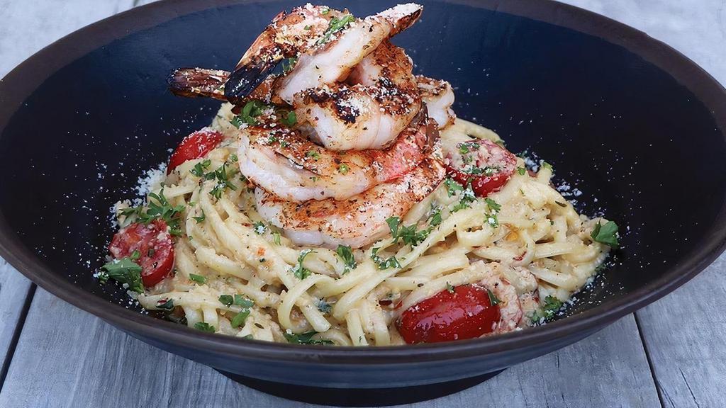 Shrimp Linguine · Blackened shrimp served atop linguine, tossed in a house-made scampi sauce with roasted grape tomatoes, parmesan & parsley