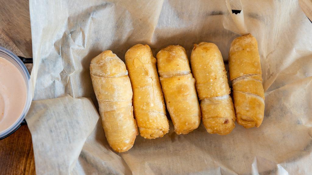 Tequenos · Cheese filled dough sticks.