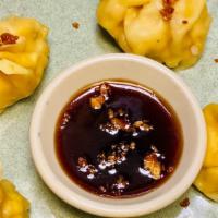 Thai Dumpling · Five pieces, Thai dumplings fried or steamed stuffed with minced chicken. Served with dried ...