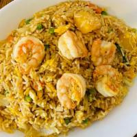 Shrimp Pineapple Curry Fried Rice · Stir fried shrimp, pineapple, peas, carrots, green onions, onions, eggs, and curry powder wi...
