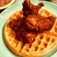 Chicken And Waffles · A Golden Belgian Waffle topped with our Crispy Buttermilk Fried Chicken Tenders.  Served wit...