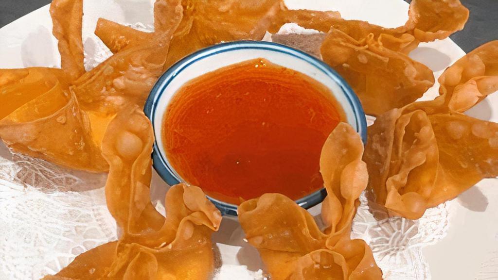 Crab Rangoon · Crispy wonton stuffed with imitation crab meat and cream cheese served with Thai Sweet Chili Sauce.