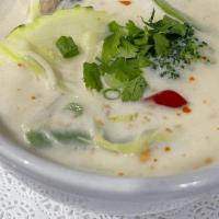 Tom Kha · (Coconut Soup) Coconut soup with mushroom in lemon-grass, cabbage, galangal, and dried hot p...