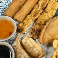 Pinto Sampler · Two spring rolls, two chicken satay, two gyozas, two crab rangoons and one curry puff.