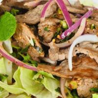 Crying Tiger Steak · Delicious North Eastern style marinated Thai steak with red onion, cilantro, green onion, se...