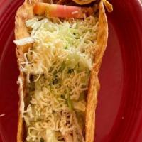Taco Salad · A large crispy flour tortilla shell lightly drizzled with cheese dip and filled with shredde...
