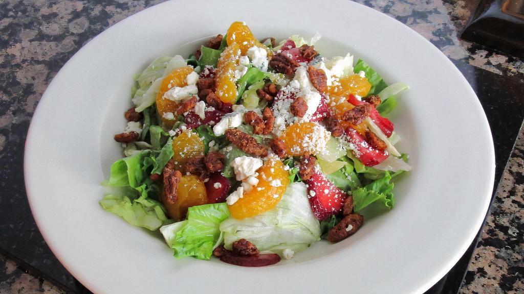 Baby Blue Salad · Mixed greens topped with blue cheese crumbles, Mandarin oranges, strawberries, and candied pecans. Served with balsamic vinaigrette. Gluten Free