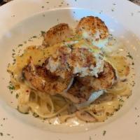 Mixed Seafood Fettuccine · A trio of scallops, jumbo shrimp with crabmeat, and a grouper fillet lightly seasoned and se...