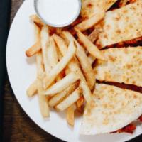 Buffalo Chicken Quesadilla · Freshly battered and fried chicken tenders tossed in Buffalo sauce then grilled in a seasone...