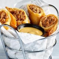 Cheeseburger Rolls · Flour tortillas stuffed with a homemade cheeseburger filling and fried until crispy.  Served...