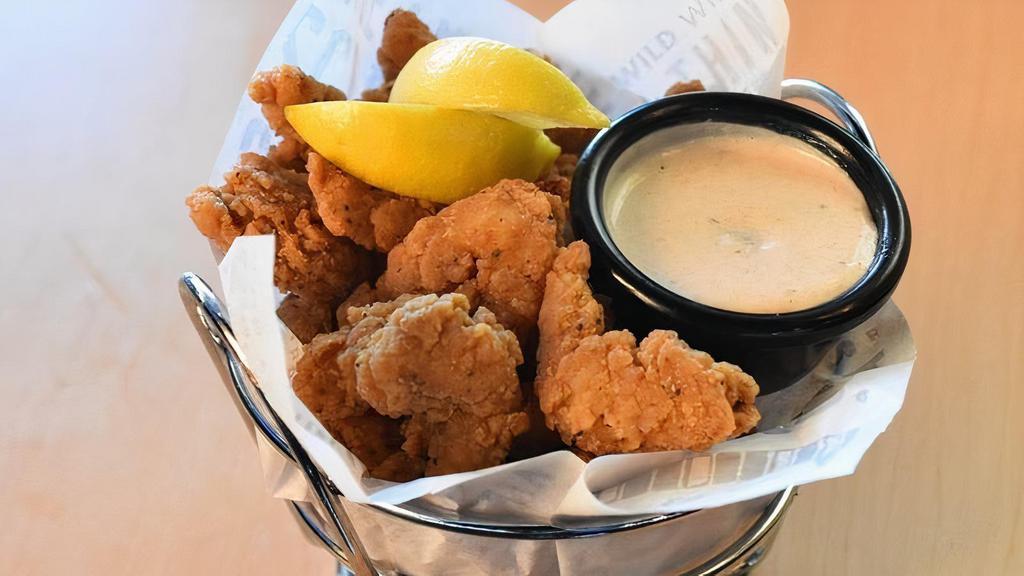 Popcorn Shrimp Basket · A generous helping of our delicious tail-less popcorn shrimp served with tangy tartar sauce for dipping