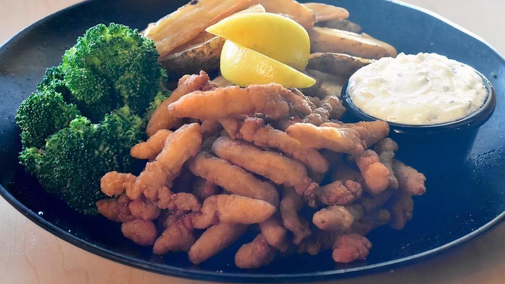 Clam Strip Platter · A Hearty pile of our fried clam strips, served with 2 sides, and tangy tartar sauce for dipping