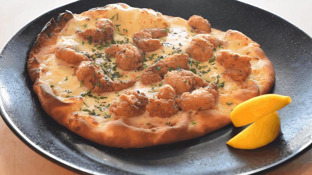 Fried Shrimp Flatbread · Our brand new flatbread, with garlic butter, Italian marinade, mozzarella cheese and our new popcorn shrimp. Scampi meets pizza!
