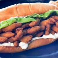 Fried Clam Po'Boy · Fried clam strips, with Bibb lettuce and tangy tartar sauce on a grilled hoagie roll.  Serve...