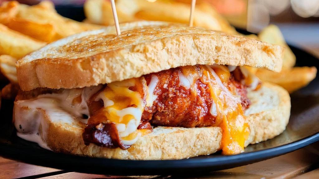 Honey Bbq Chicken Toasty · Hand-Breaded Chicken Tenders, bathed in homemade Honey BBQ Sauce, Cheddar Cheese, Bacon and Ranch Dressing on Grilled Sourdough Bread