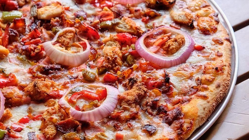 Traditional Crust - Meat Lovers Pizza 16 Inch · All the meats!  Chicken, Chicken Sausage, Bacon, , Ham, Red Onions and Sautéed peppers