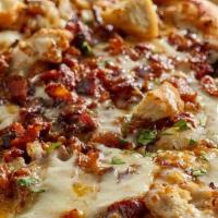 Traditional Crust - Bbq Chicken Pizza 16 Inch · Mad Anthony's BBQ sauce, red onions, cheddar cheese, ranch, and fried chicken tenders