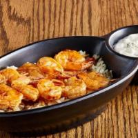 Buffalo Shrimp · Ten Fried or Grilled shrimp tossed in our hot sauce and served with bleu cheese and celery..