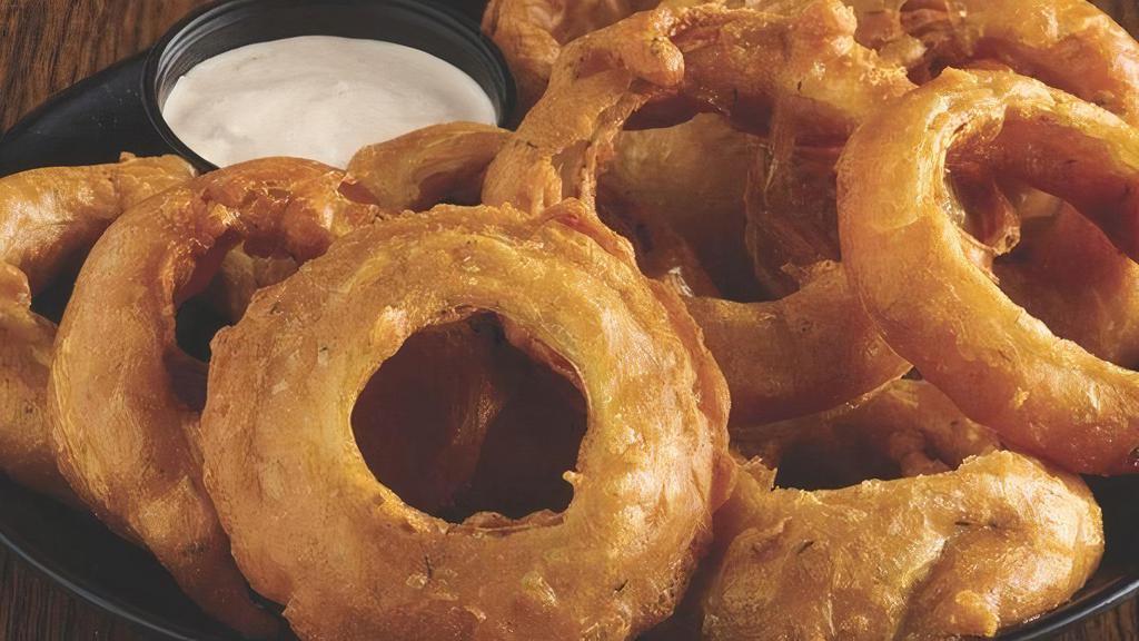 Onion Rings · Hand dipped in our homemade spicy beer batter and served with southwest ranch..