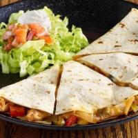 Chicken Quesadilla · Chicken, caramelized onions and roasted peppers in a cheesy, golden brown tortilla served wi...