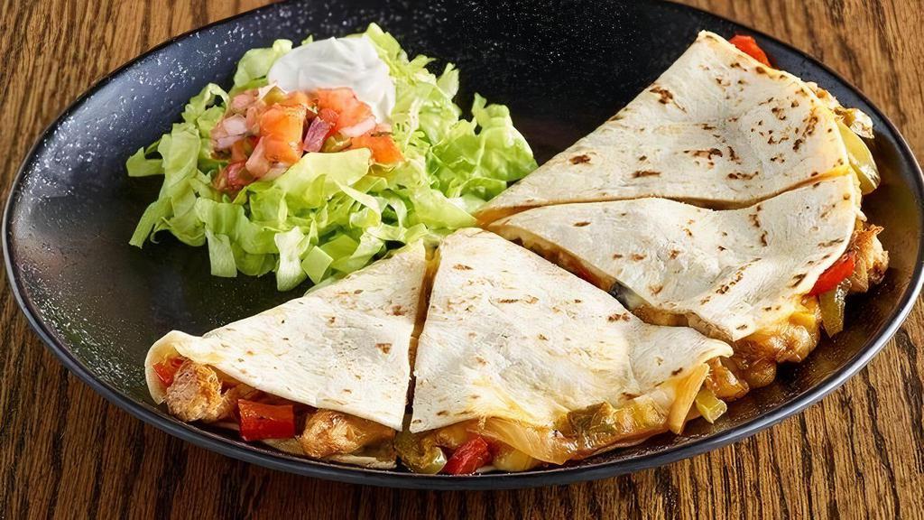 Chicken Quesadilla · Chicken, caramelized onions and roasted peppers in a cheesy, golden brown tortilla served with salsa and sour cream..
