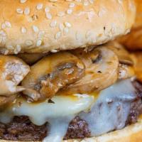 Mushroom Swiss Burger · 1/2 Pound Always Fresh Burger topped with Swiss and Mushrooms sautéed in Ranchilada and Garl...