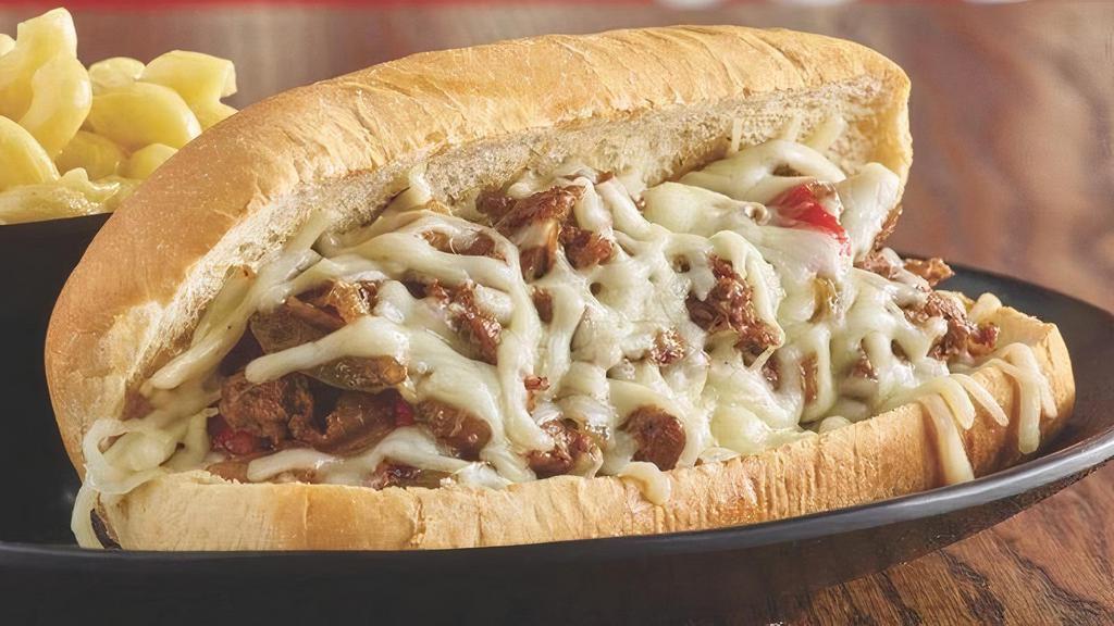Fabulous Philly Hoagie · Shaved tender marinated steak, caramelized onions, roasted peppers and melted white American cheese on a soft hoagie roll..