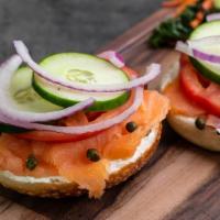 Nova Nosh Sandwich · smoked salmon, plain cream cheese, tomatoes, cucumber, red onion, and capers on a plain bagel