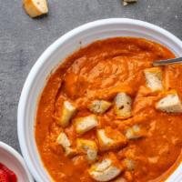 Roasted Red Pepper Gouda · red pepper gouda soup topped with sautéed croutons and served with a fresh-baked breadstick