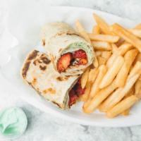 Chicken Frankie · Spiced chicken and mixed salad rolled in paratha served with fries and soda.