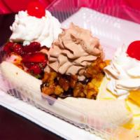 Banana Split · your choice of three scoops of ice cream with a banana, split lengthwise topped with Moscato...