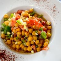 Ensalada De Garbanzos · Chickpeas salad, diced tomato, onions. Zucchini, chickpeas, olive oil vinaigrette, Feta chee...