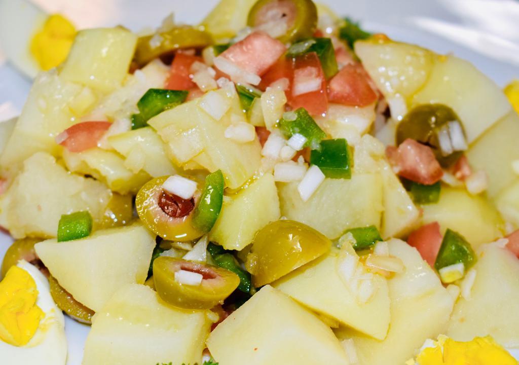 Ensalada Campera · Campera salad, piquillo peppers, diced tomatoes, onions, boiled potatoes, olives, boiled egg, olive oil.