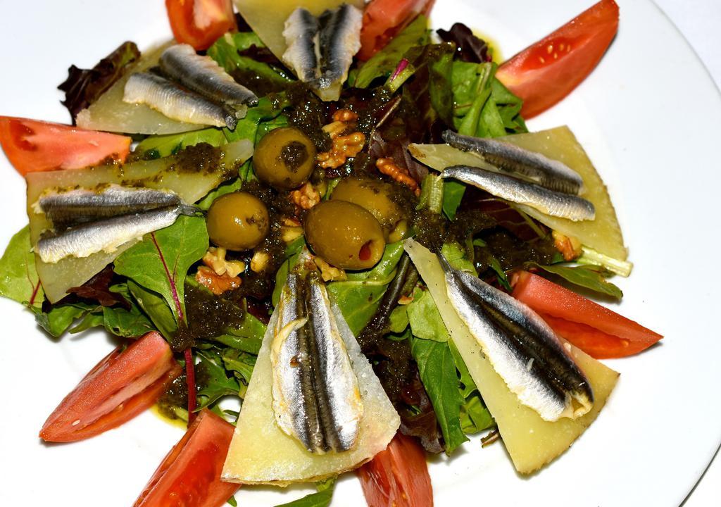 Ensalada Manchego Y Boquerones · Manchego cheese and white anchovies, manchego, greens, olives, vinaigrette, white anchovies.
