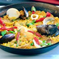 Paella De Mariscos · Calamari, shrimp, mussels, clams, langoustine.