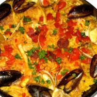 Paella Valenciana · Calamari, shrimp, mussels, clams, sausage, chicken.