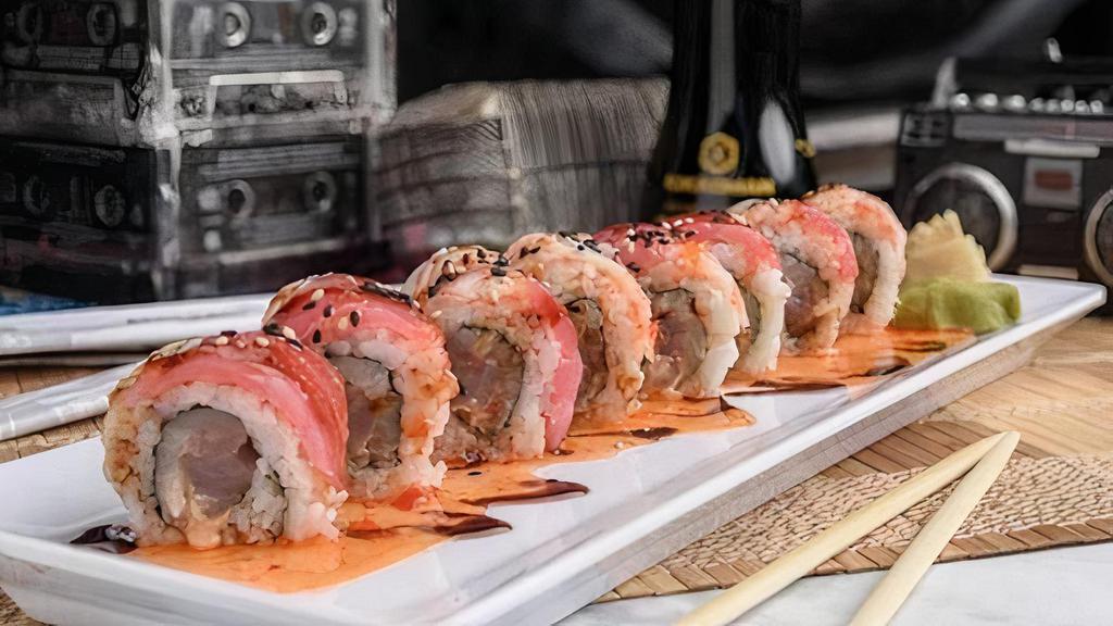 Jam Sesh Roll · Gang’s all here. Yellowtail, albacore tuna and spicy mayo inside, red tuna and crab stick outside, topped with sweet chili, eel sauce and sesame seeds.