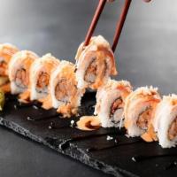 Prima Donna Roll · Cajun-seasoned crawfish inside, crab. stick outside, topped with spicy mayo, eel sauce and c...
