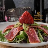 Ahi Tuna Salad · Open wide and say AHI. Just-seared tuna slices, cucumber, avocado and strawberries piled on ...