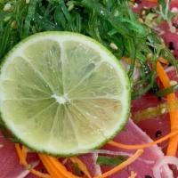 Tuna Tataki · Thin slices of seared tuna with ponzu sauce. **Raw/undercooked**