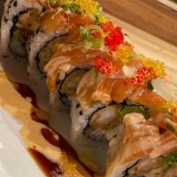 Sri Thai Roll · Shrimp tempura, snow crab meat, cucumber and avocado topped with smoked salmon. Raw/undercoo...